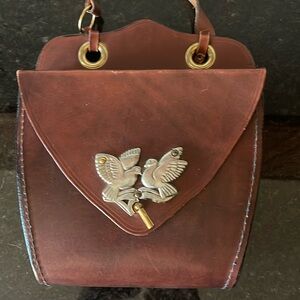 Vintage brown leather purse with silver bird buckle